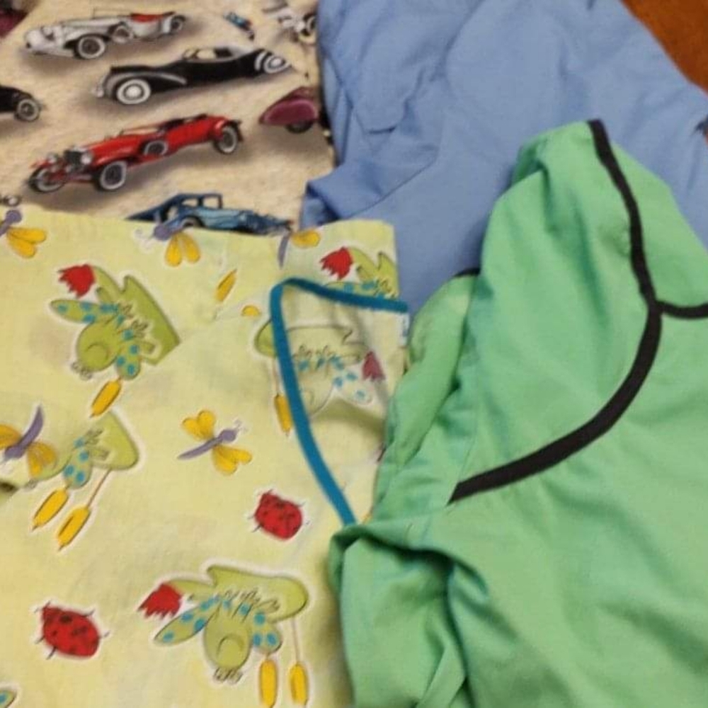 Bundle of four scrub tops size 2XL.